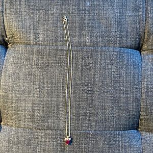 Ruby heart set in gold